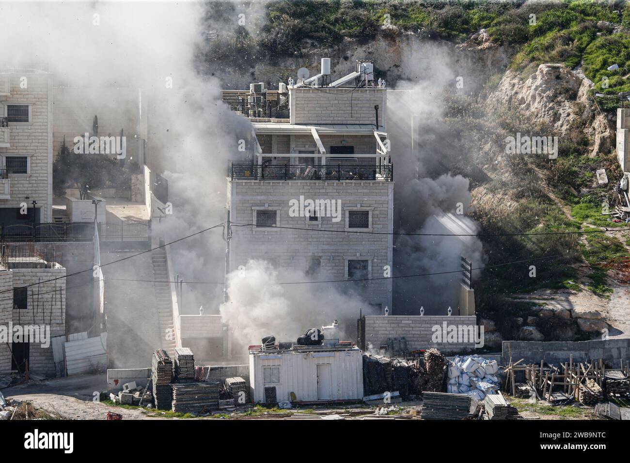 Jerusalem Israel 09th Jan 2024 Smoke Rises As Israeli Security   Jerusalem Israel 09th Jan 2024 Smoke Rises As Israeli Security Forces Demolish The Home Of Two Hamas Militants In The Palestinian East Jerusalem Neighborhood Of Sur Bahir On The Instructions Of Israeli Prime Minister Benjamin Netanyahu Two Houses Belonging To Two Palestinian Brothers Who Allegedly Caused The Death Of 3 Israelis In An Armed Attack On November 30 Were Destroyed Israeli Forces Surrounded The Houses Of Brothers Murad And Ibrahim Nemr In The Town Of Sur Bahir And Blew Them Up With A Bomb Credit Sopa Images Limitedalamy Live News 2WB9NTC 