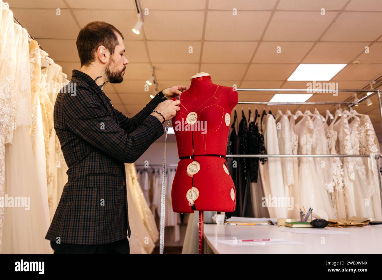 Tailor taking measure hi-res stock photography and images - Alamy