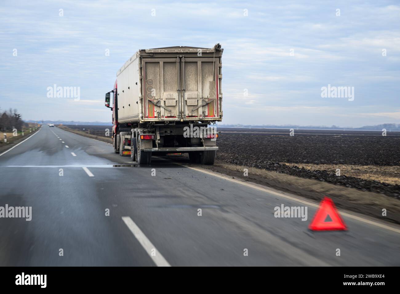 Truck on the road with tire defect, selective focus Stock Photo