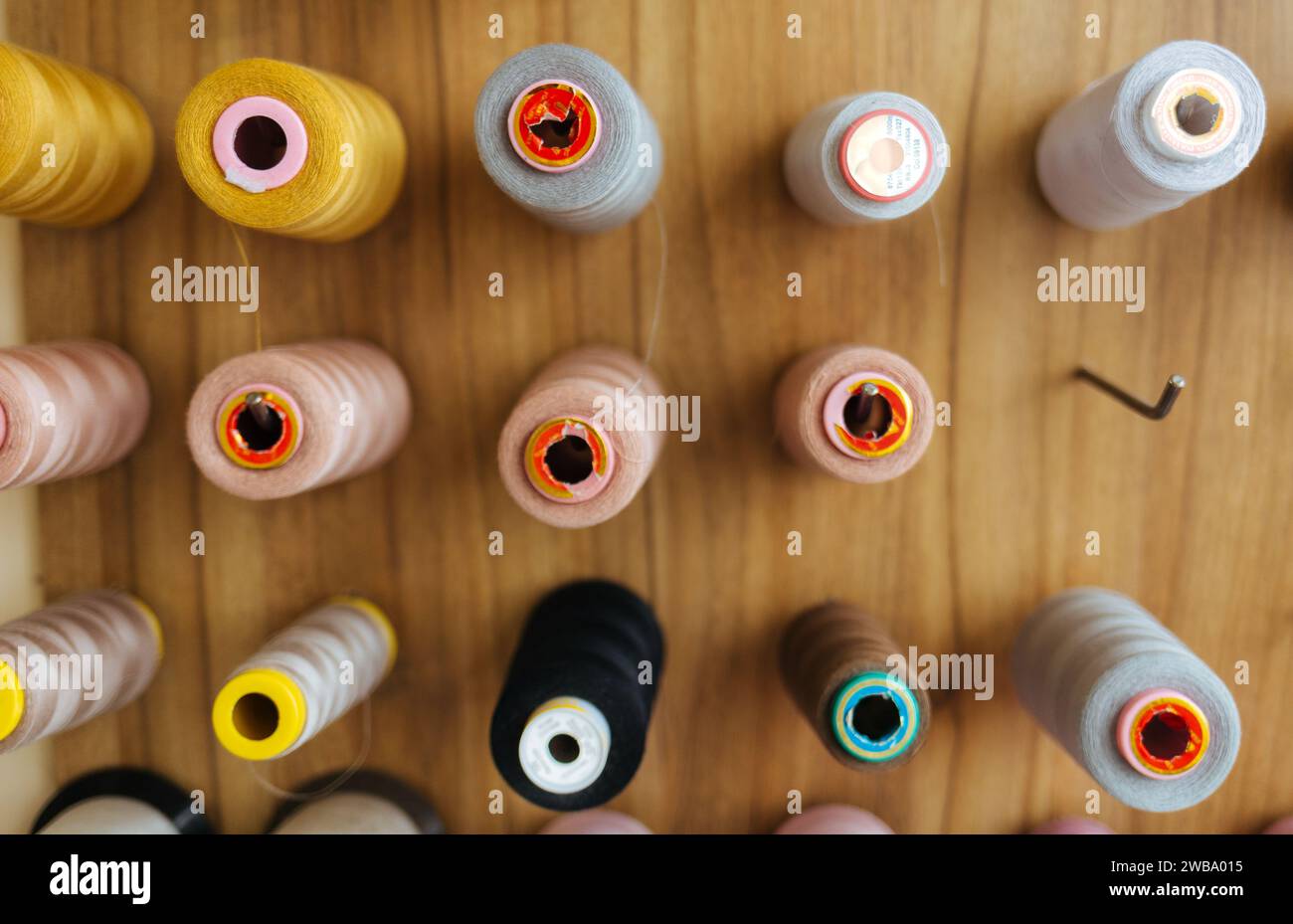 Sewing threads as a multicolored background close up Stock Photo