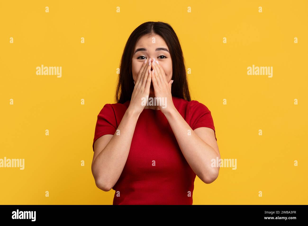 Surprised young chinese woman cover her mouth Stock Photo Alamy