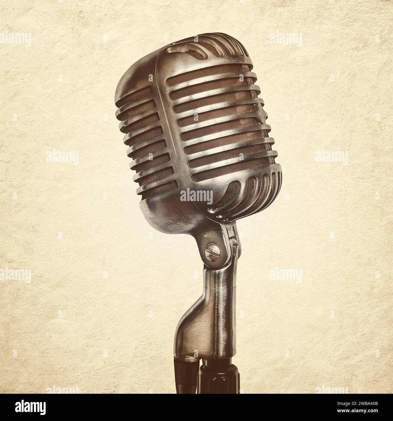 Retro styled image of an authentic vintage audio microphone on stand Stock Photo