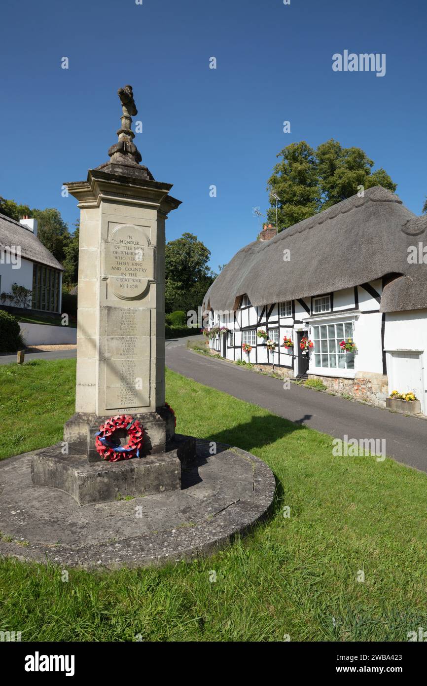 Thatched cottages and war memorial on the village green, Wherwell, Test Valley, Hampshire, England, United Kingdom, Europe Stock Photo