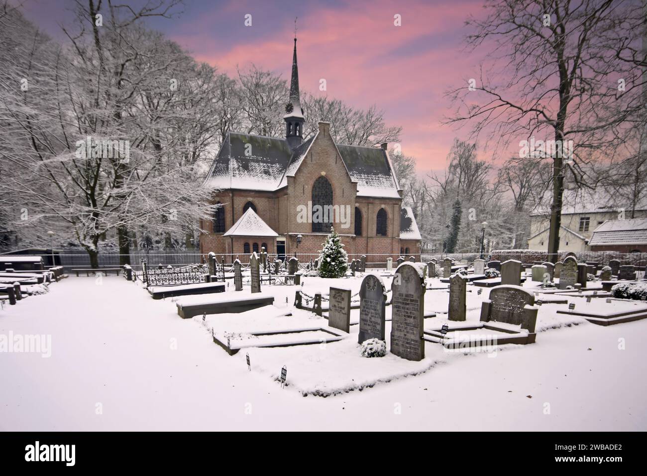 Little snowy church in Lage Vuursche in winter in the Netherlands Stock Photo