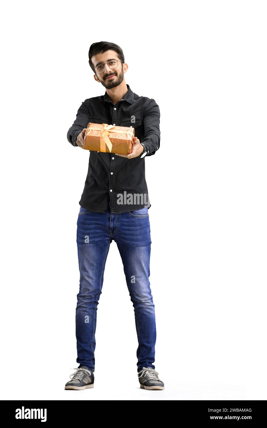 A man, on a white background, in full height, with a gift Stock Photo