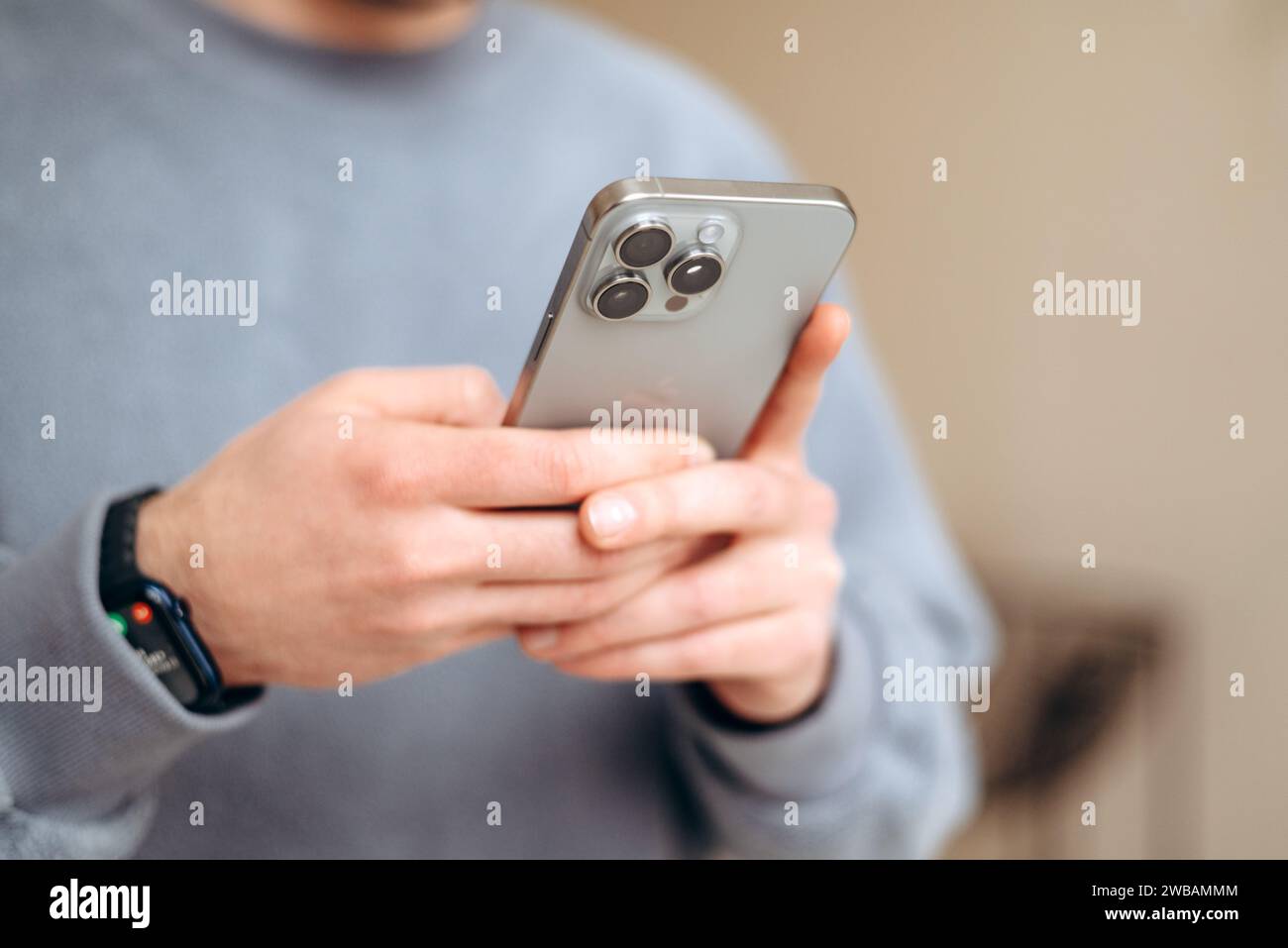holding cellphone in hands. texting message, scrolling Stock Photo