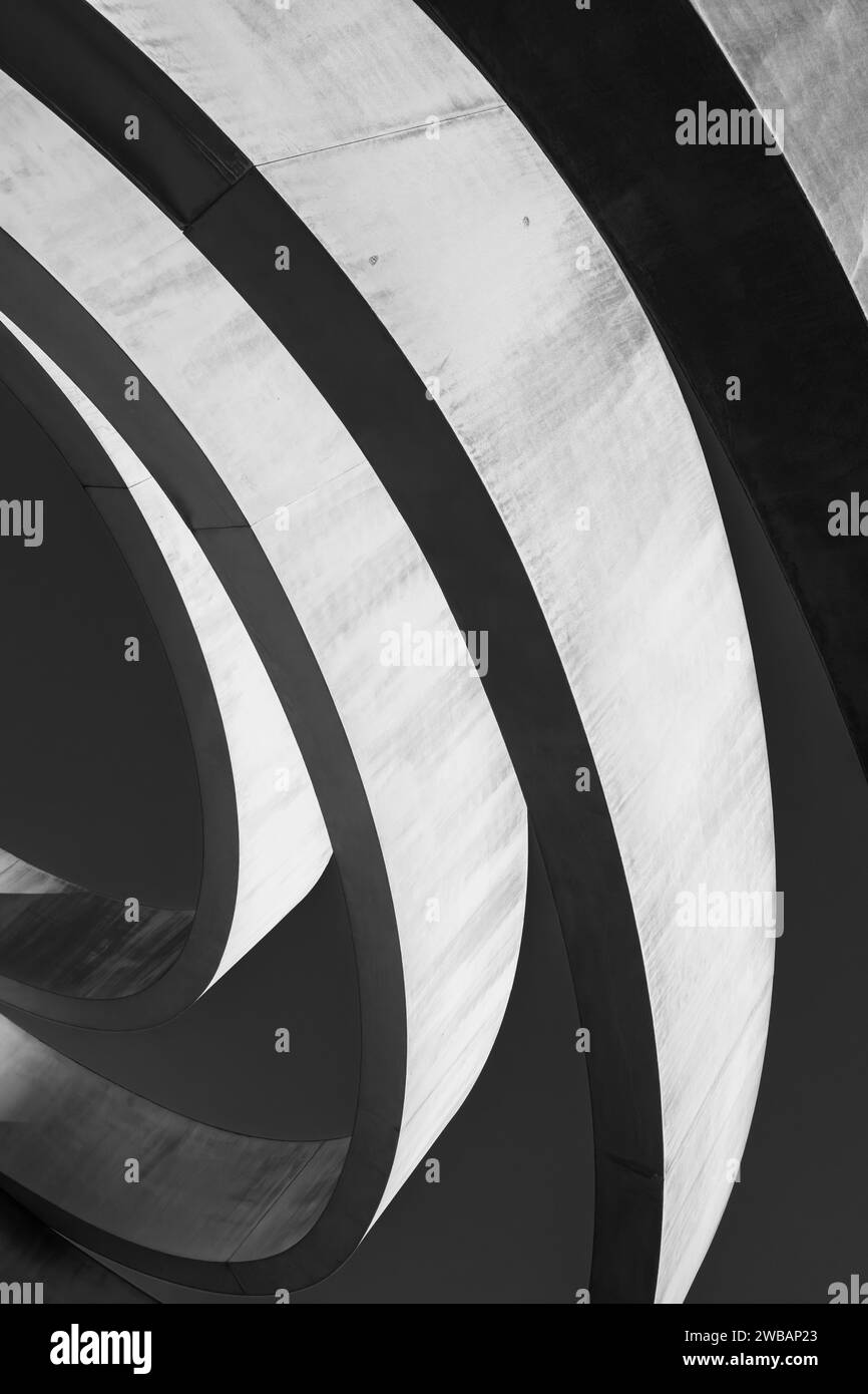 Striking monochrome architectural feature with sweeping curves and a