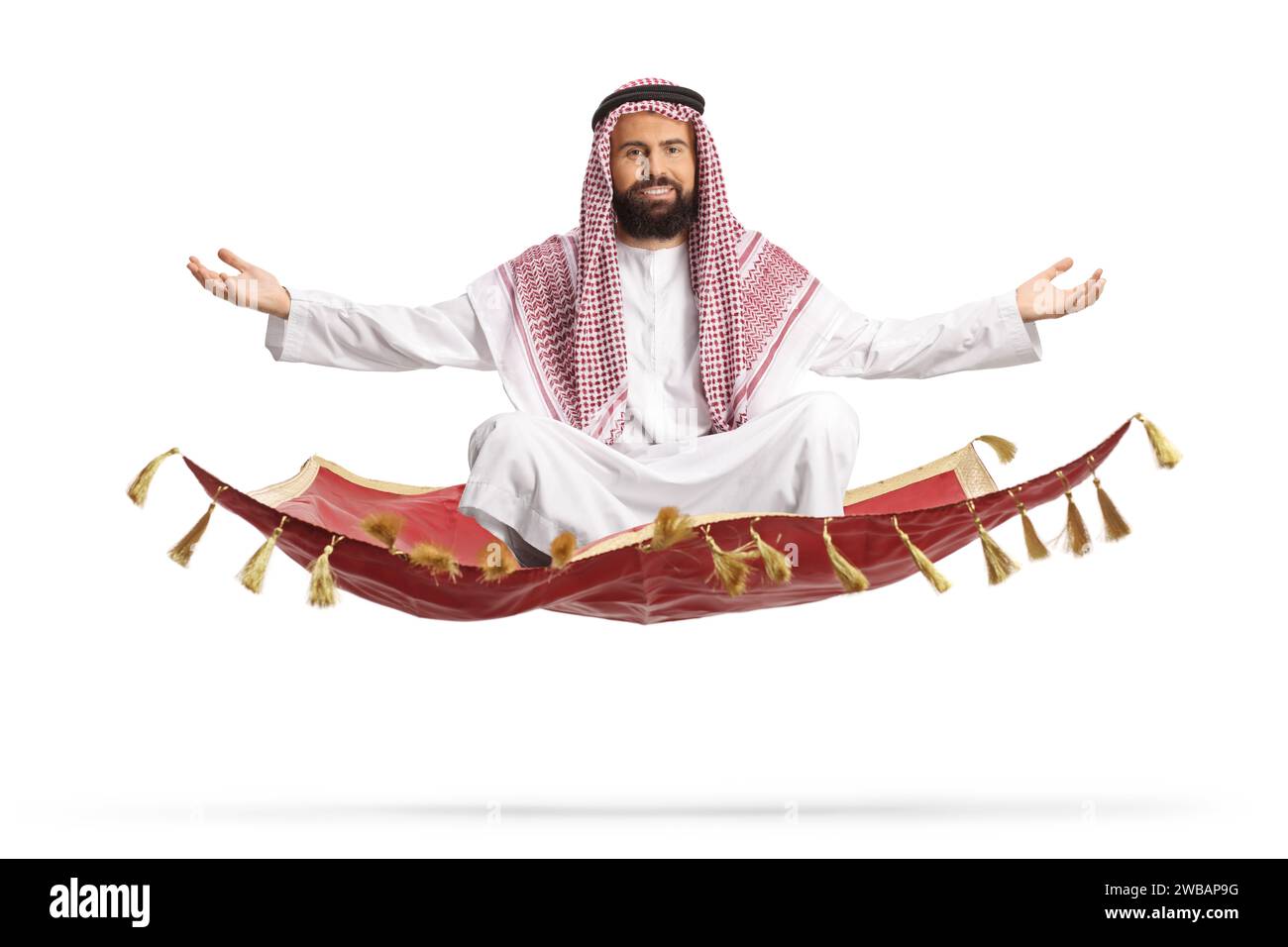 Saudi arab man floating on a magic carpet isolated on white background Stock Photo