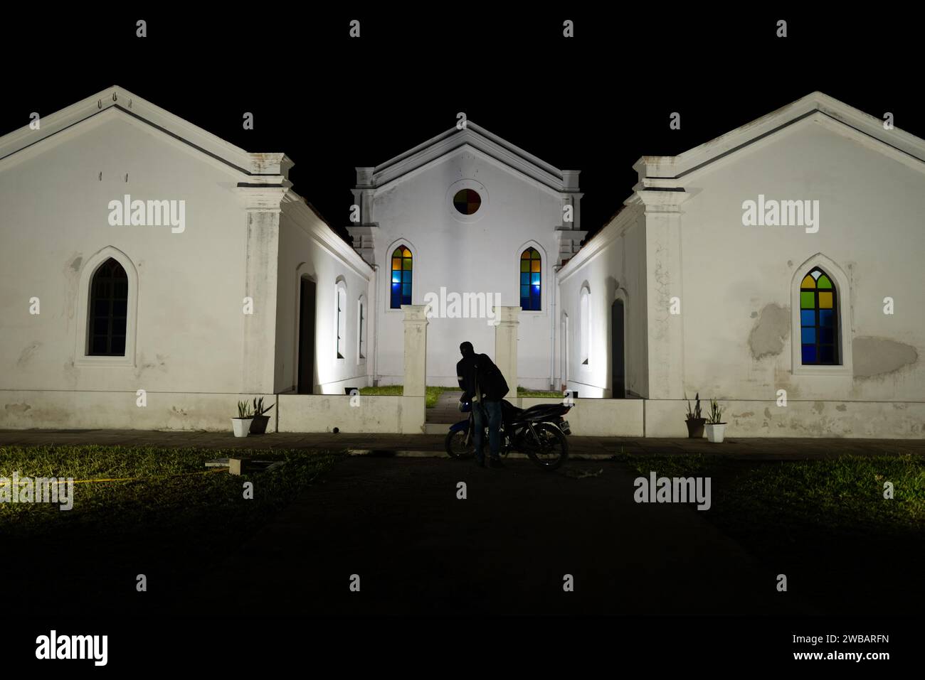 A stunning white church building illuminated at night in Quelimane, Mozambique Stock Photo