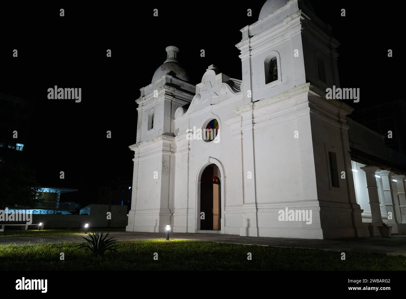 A stunning white church building illuminated at night in Quelimane, Mozambique Stock Photo