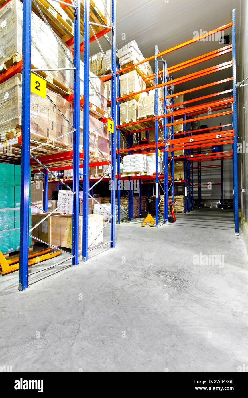Racks with goods in big industrial warehouse Stock Photo - Alamy