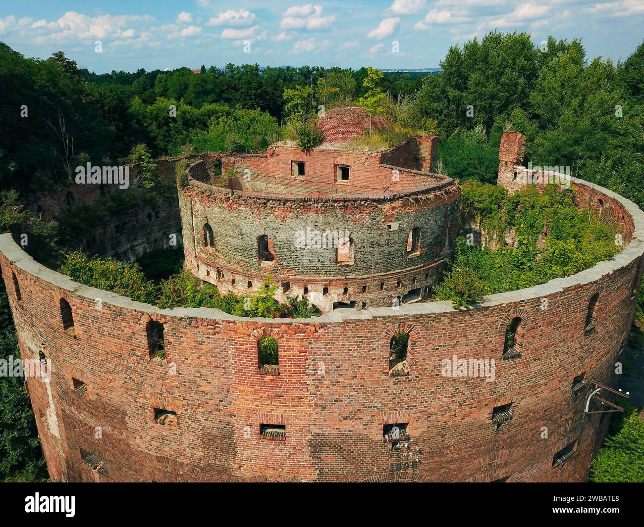 An abandoned old military building, photographed by a drone while nature is slowly taking it back Stock Photo