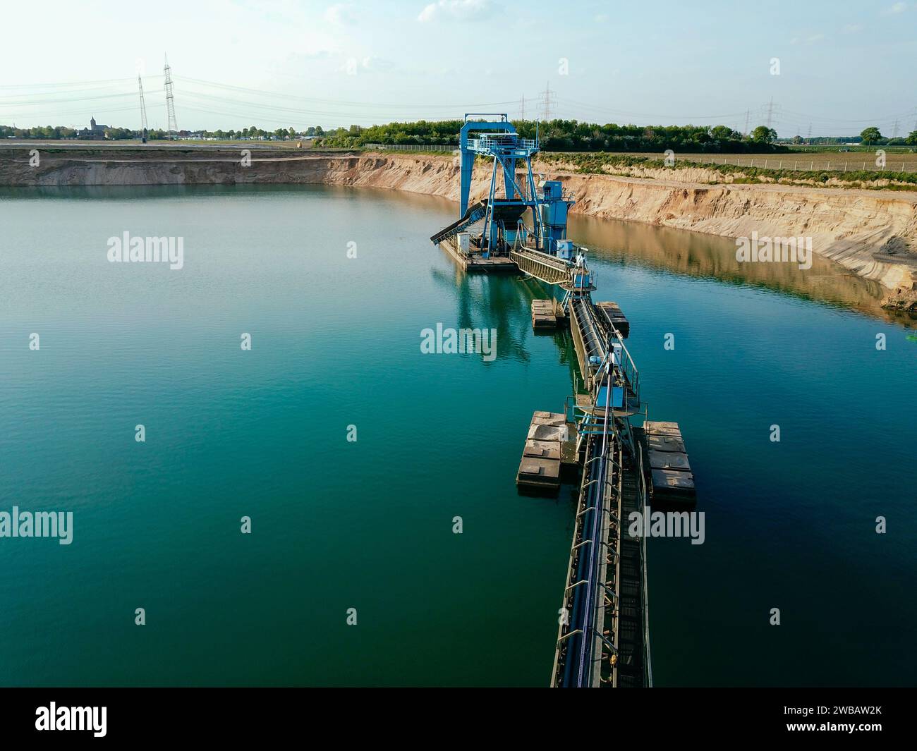 A gravel plant on a lake, photographed with a drone Stock Photo