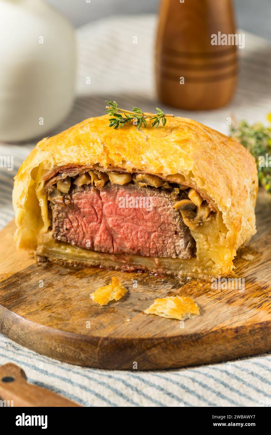 Homemade Individual Beef Wellingtons with Asparagus and Potatoes Stock Photo