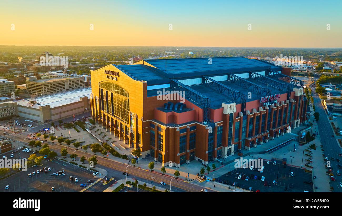 Aerial Golden Hour Glow on Indianapolis Stadium and Cityscape Stock