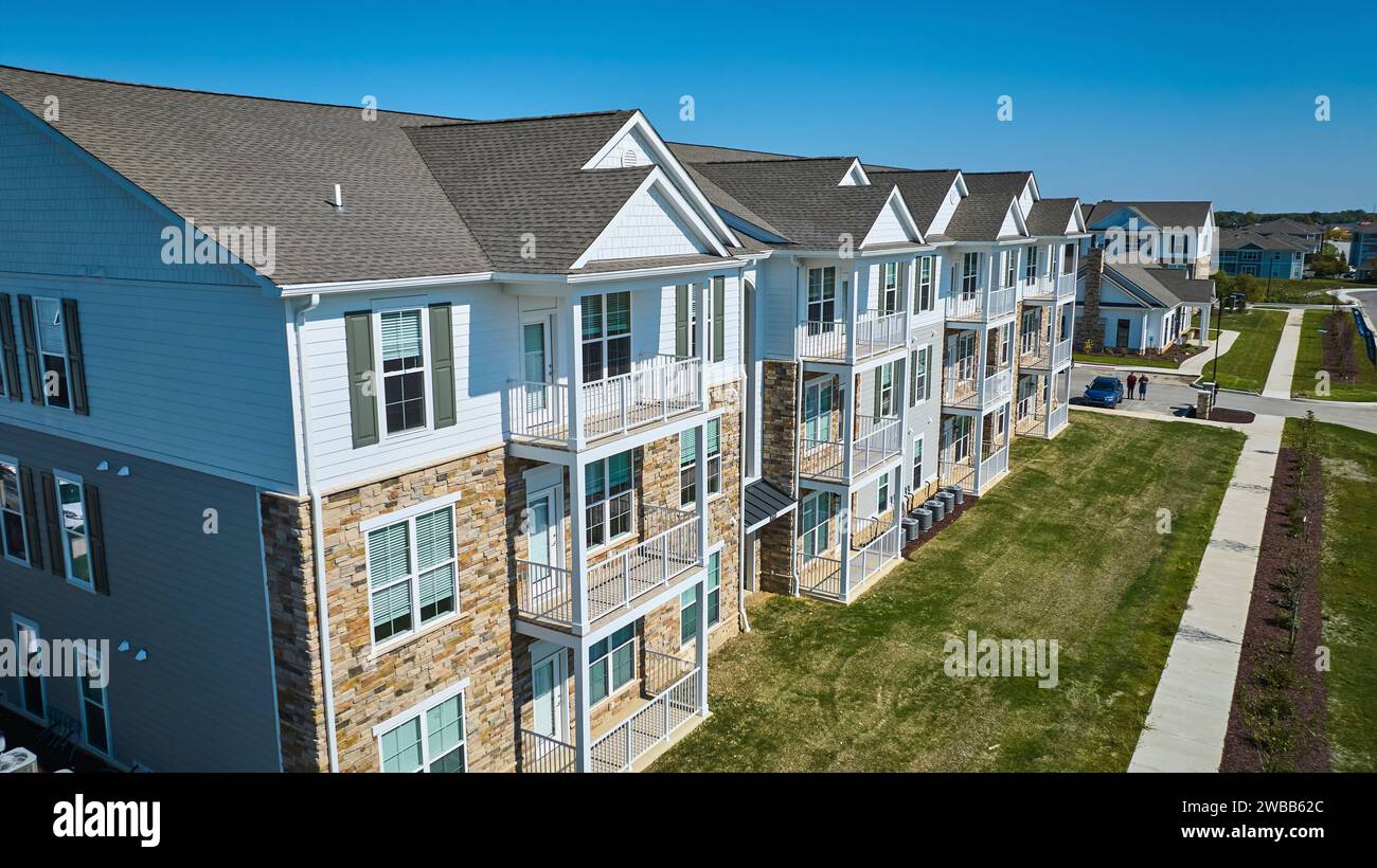 Aerial View of Sunny Modern Apartment Complex with Landscaped Lawn ... - Luxury Apartments With Beautifully Landscaped Grounds