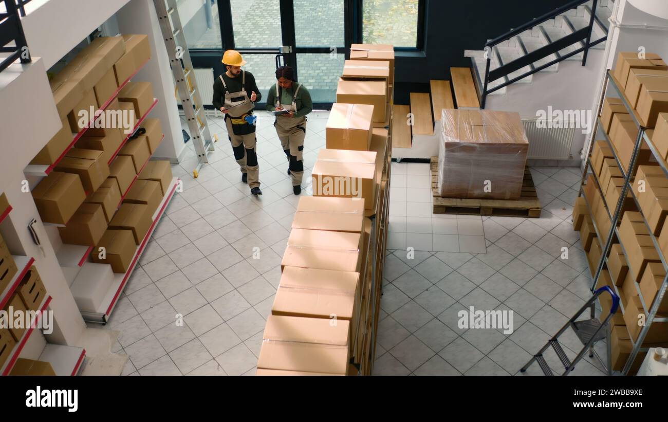 Group Inspecting Box Inspecting warehouse shelves woman hi-res stock photography and images ...