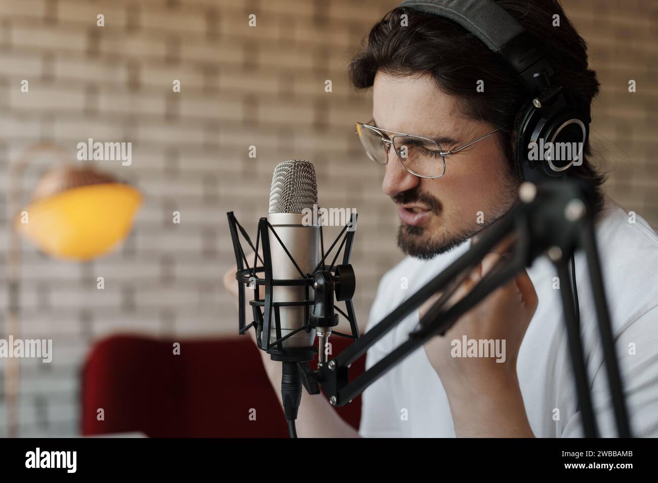 Musician Immersed in Recording a Soulful Track Stock Photo
