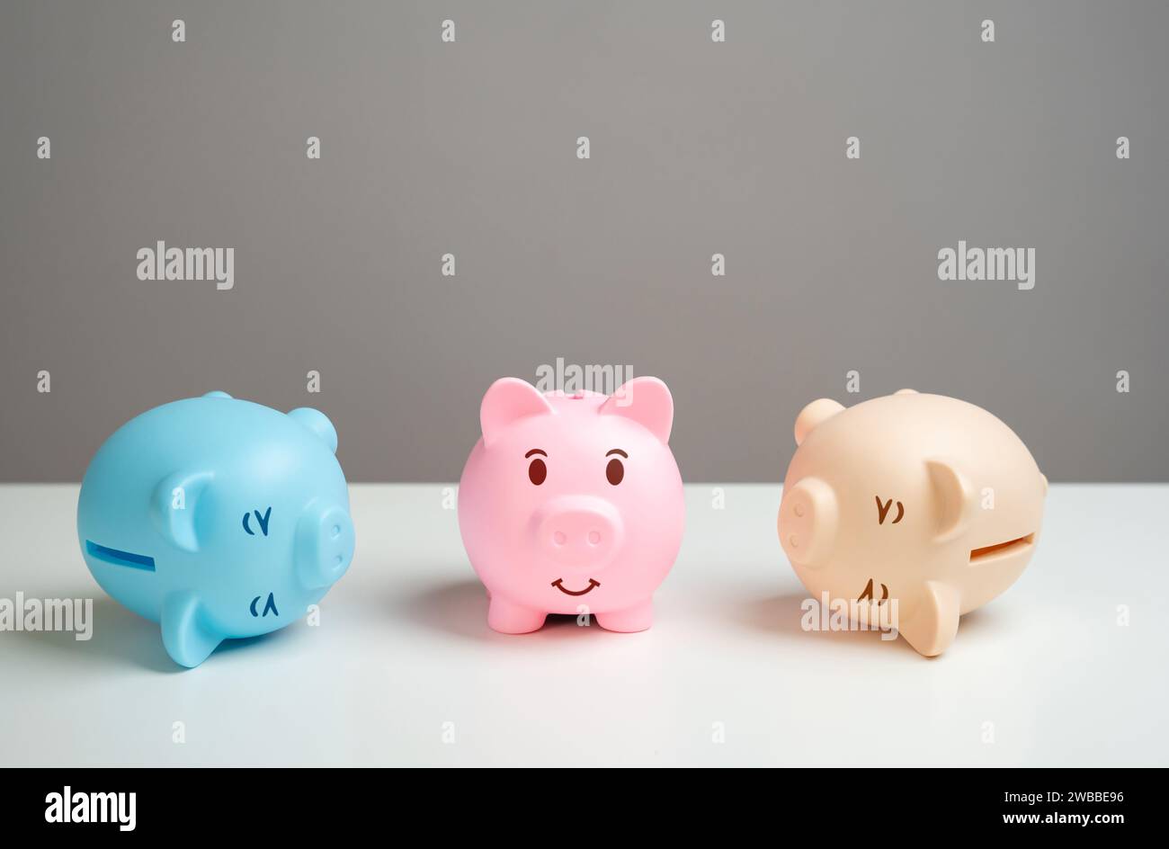 A reliable way to save money. One of the piggy banks' piggy banks stood on its feet after the crisis and adversity. Refinancing of debts. Economic dep Stock Photo