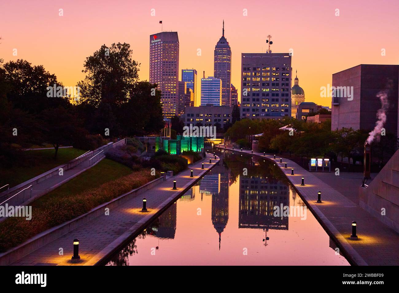 Indianapolis Skyline at Sunset with Reflective Canal Waters Stock Photo
