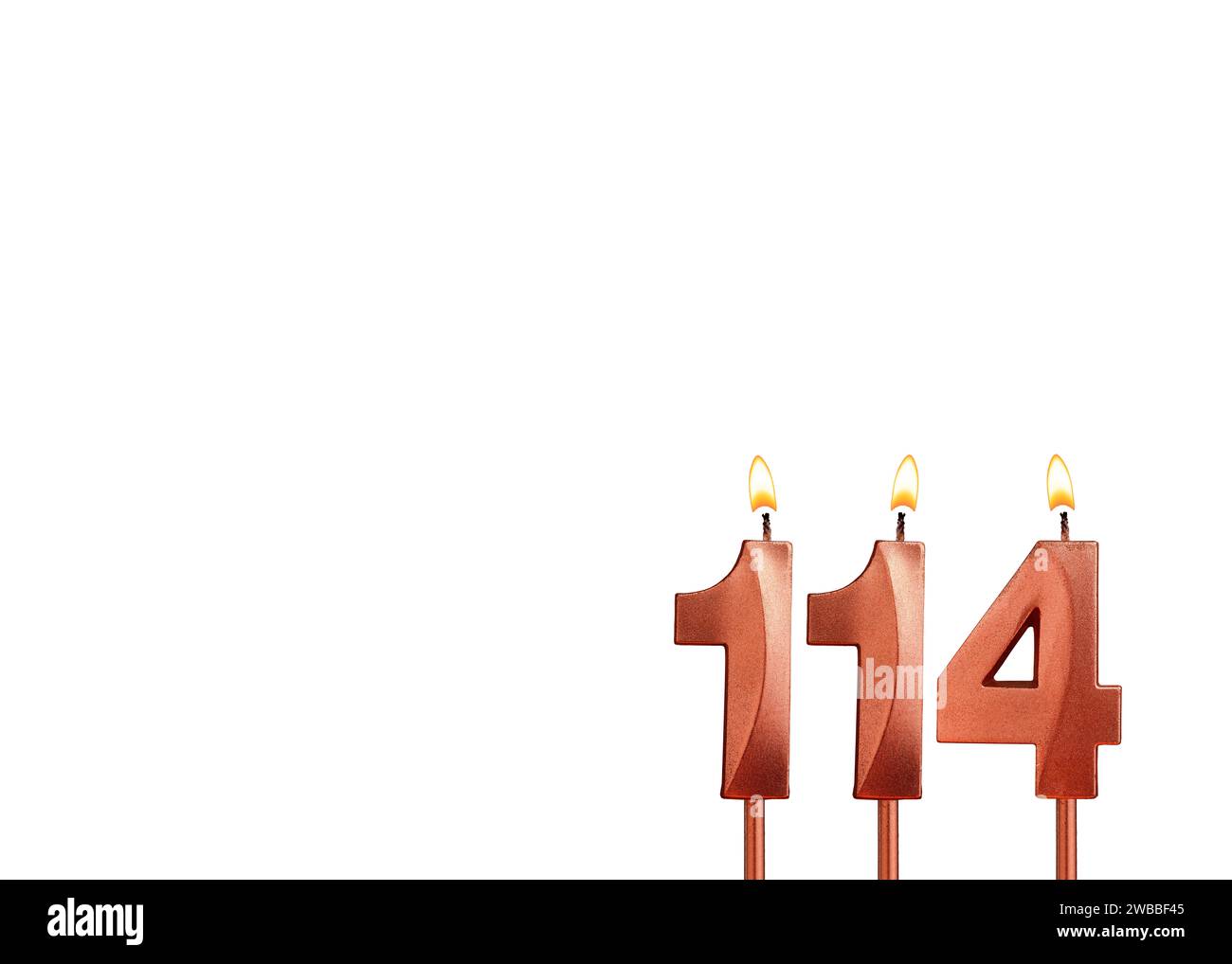 Burning candle number 114 for birthday on white background Stock Photo
