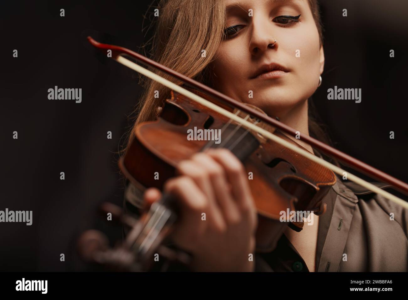 Baroque violin, under the touch of a skilled player, revives the sounds of a bygone era Stock Photo