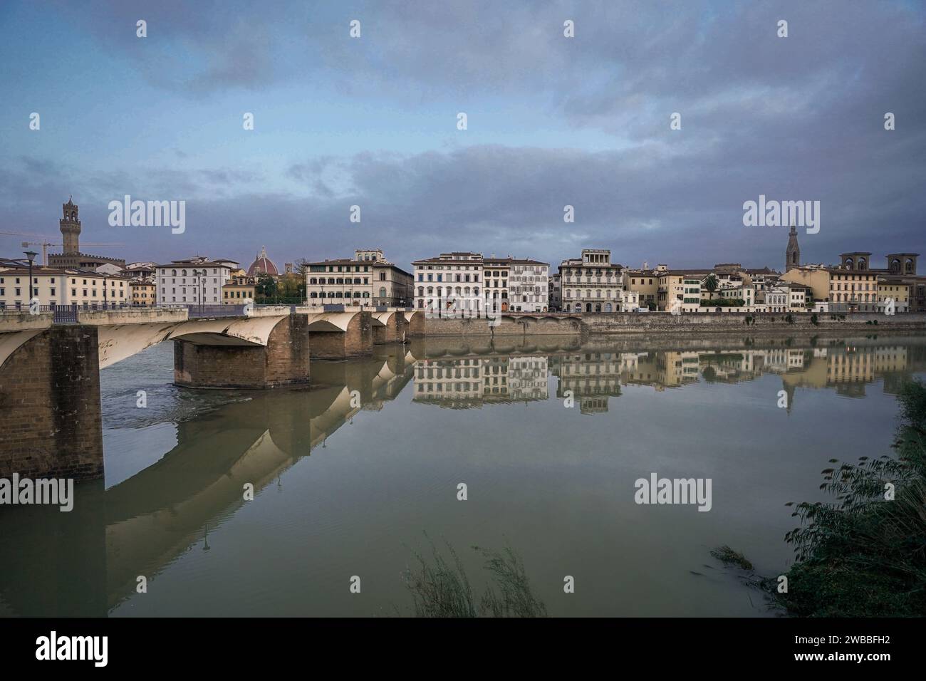 Arno river with bridges and surrounding buildings in Florence, Italy Stock Photo