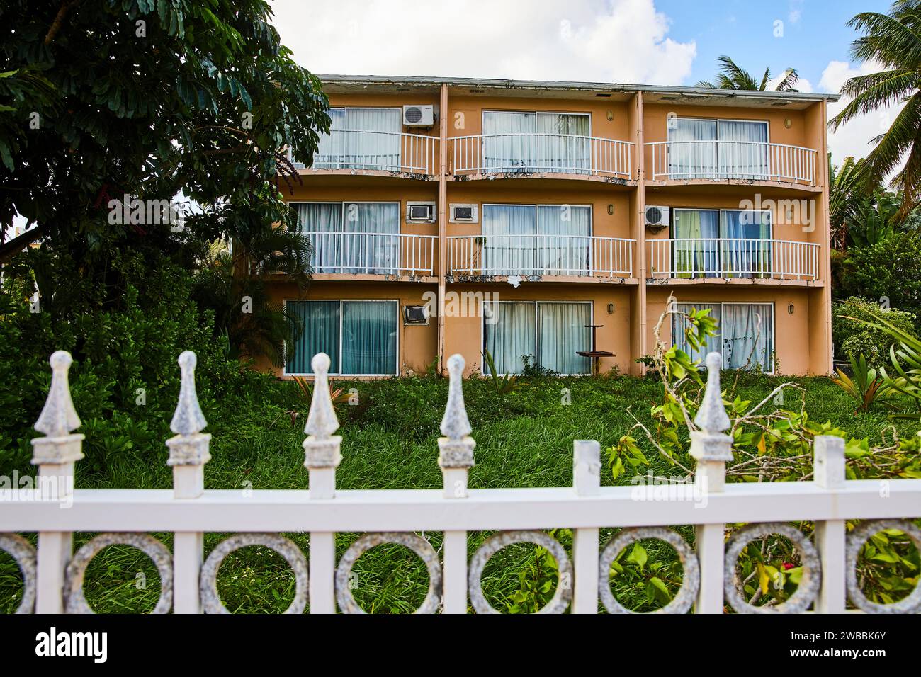 Vintage Tropical Apartment Complex in Nassau with Lush Greenery Stock