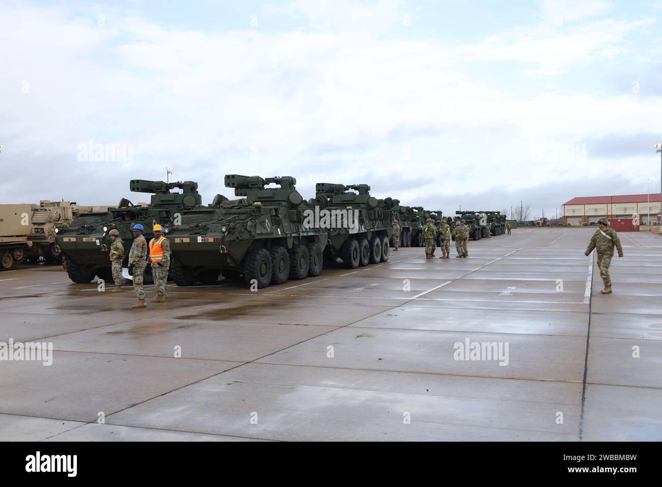 Soldiers from the 75th Field Artillery Brigade; the 2nd Battalion, 18th Field Artillery Regiment; and the 4th Battalion, 60th Air Defense Artillery Regiment load various military vehicles onto rails in preparation for an Emergency Deployment Readiness Exercise (EDRE) at the National Training Center (NTC). Stock Photo