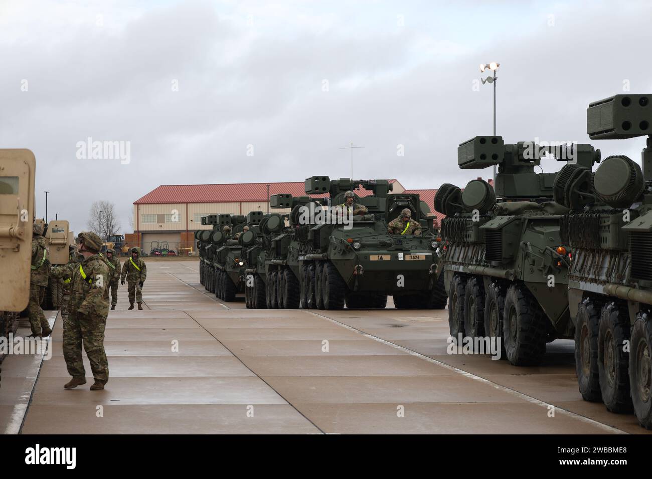 Soldiers from the 75th Field Artillery Brigade; the 2nd Battalion, 18th Field Artillery Regiment; and the 4th Battalion, 60th Air Defense Artillery Regiment load various military vehicles onto rails in preparation for an Emergency Deployment Readiness Exercise (EDRE) at the National Training Center (NTC). Stock Photo
