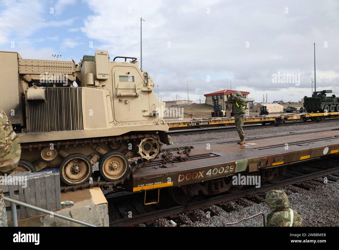 Soldiers from the 75th Field Artillery Brigade; the 2nd Battalion, 18th Field Artillery Regiment; and the 4th Battalion, 60th Air Defense Artillery Regiment load various military vehicles onto rails in preparation for an Emergency Deployment Readiness Exercise (EDRE) at the National Training Center (NTC). Stock Photo