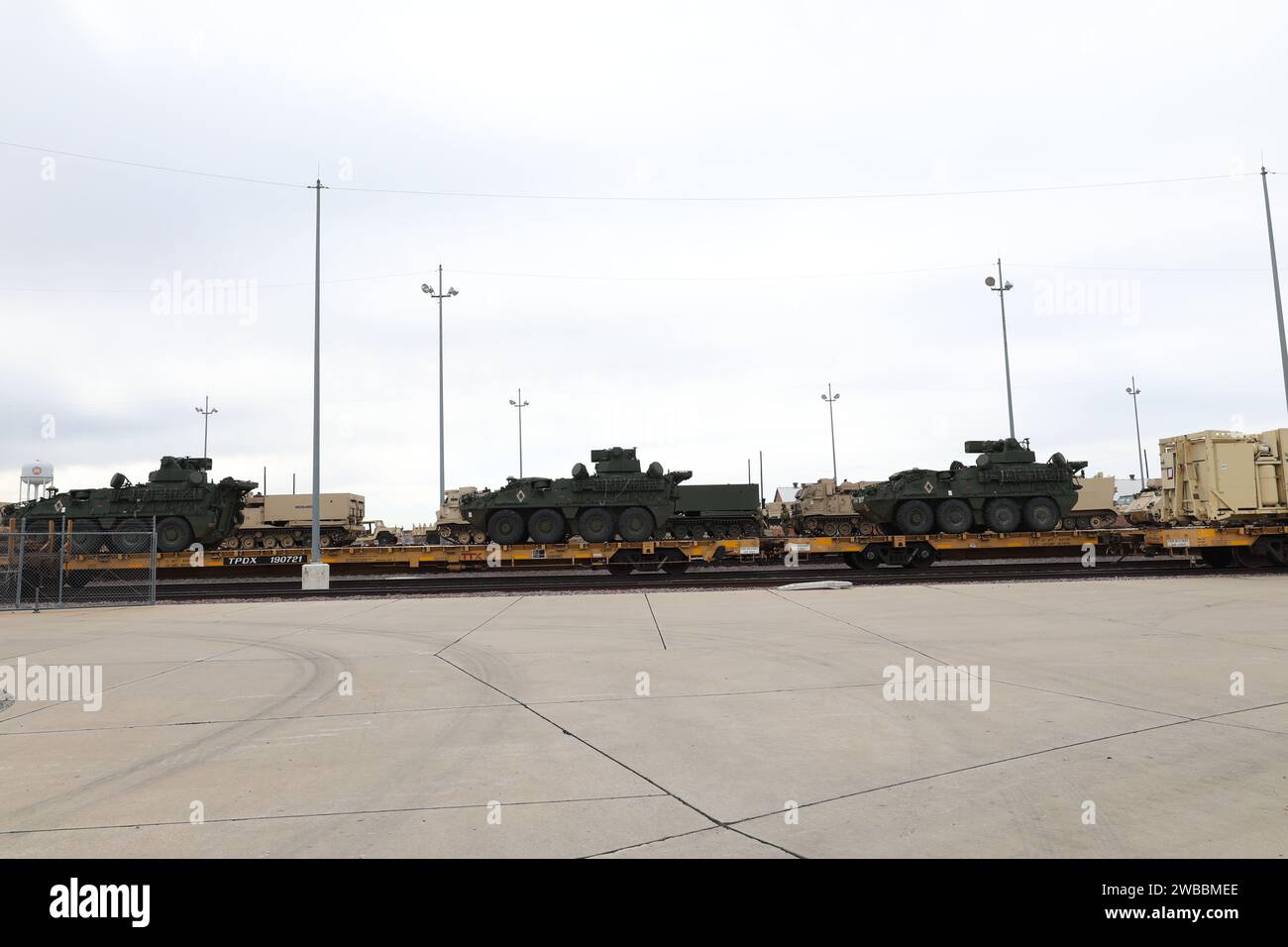 Soldiers from the 75th Field Artillery Brigade; the 2nd Battalion, 18th Field Artillery Regiment; and the 4th Battalion, 60th Air Defense Artillery Regiment load various military vehicles onto rails in preparation for an Emergency Deployment Readiness Exercise (EDRE) at the National Training Center (NTC). Stock Photo