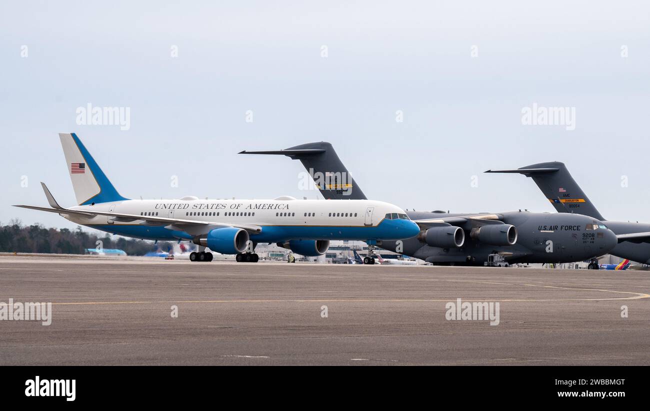 Air Force One taxis past several C 17 Globemaster III cargo aircraft at Joint Base Charleston South Carolina Jan. 8 2024. Known for its pivotal role in providing executive support airlift JB Charlesto...