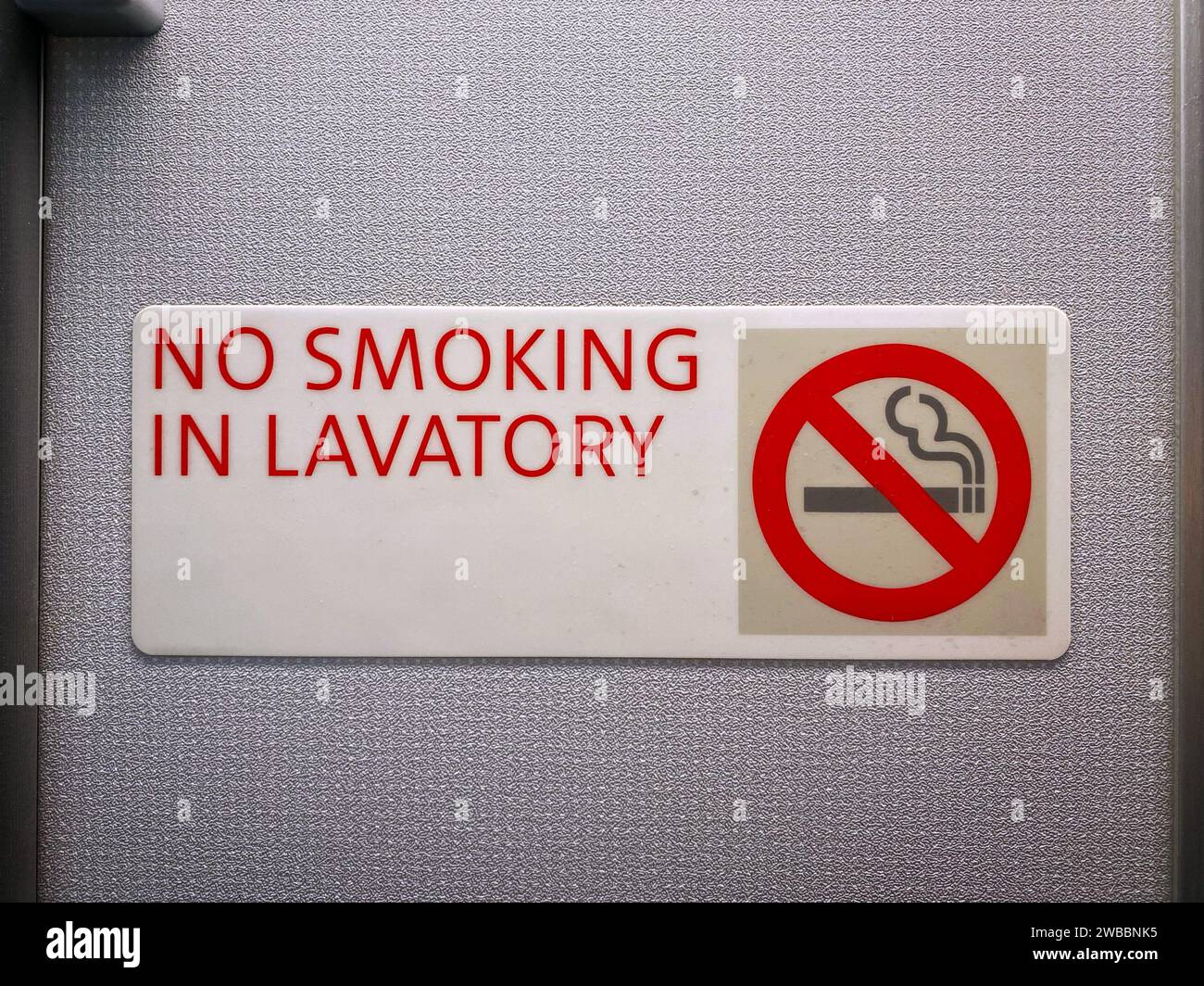 Airplane lavatory 'no smoking' sign Stock Photo