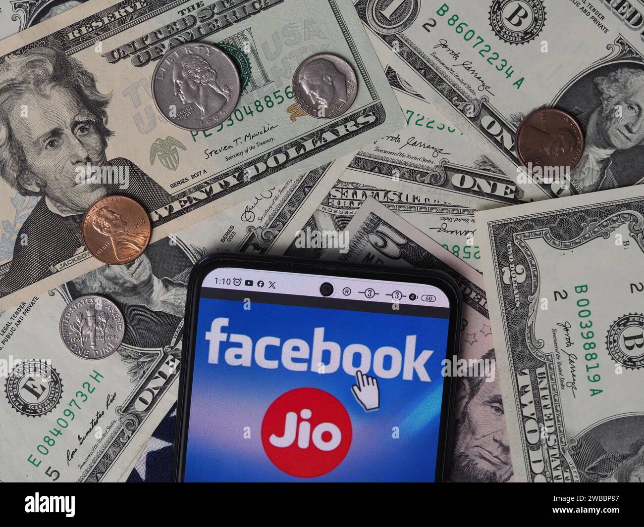 Bavaria, Germany - January 10, 2024: In this photo illustration, a Reliance Jio Infocomm Limited logo seen displayed on a smartphone with United State Stock Photo