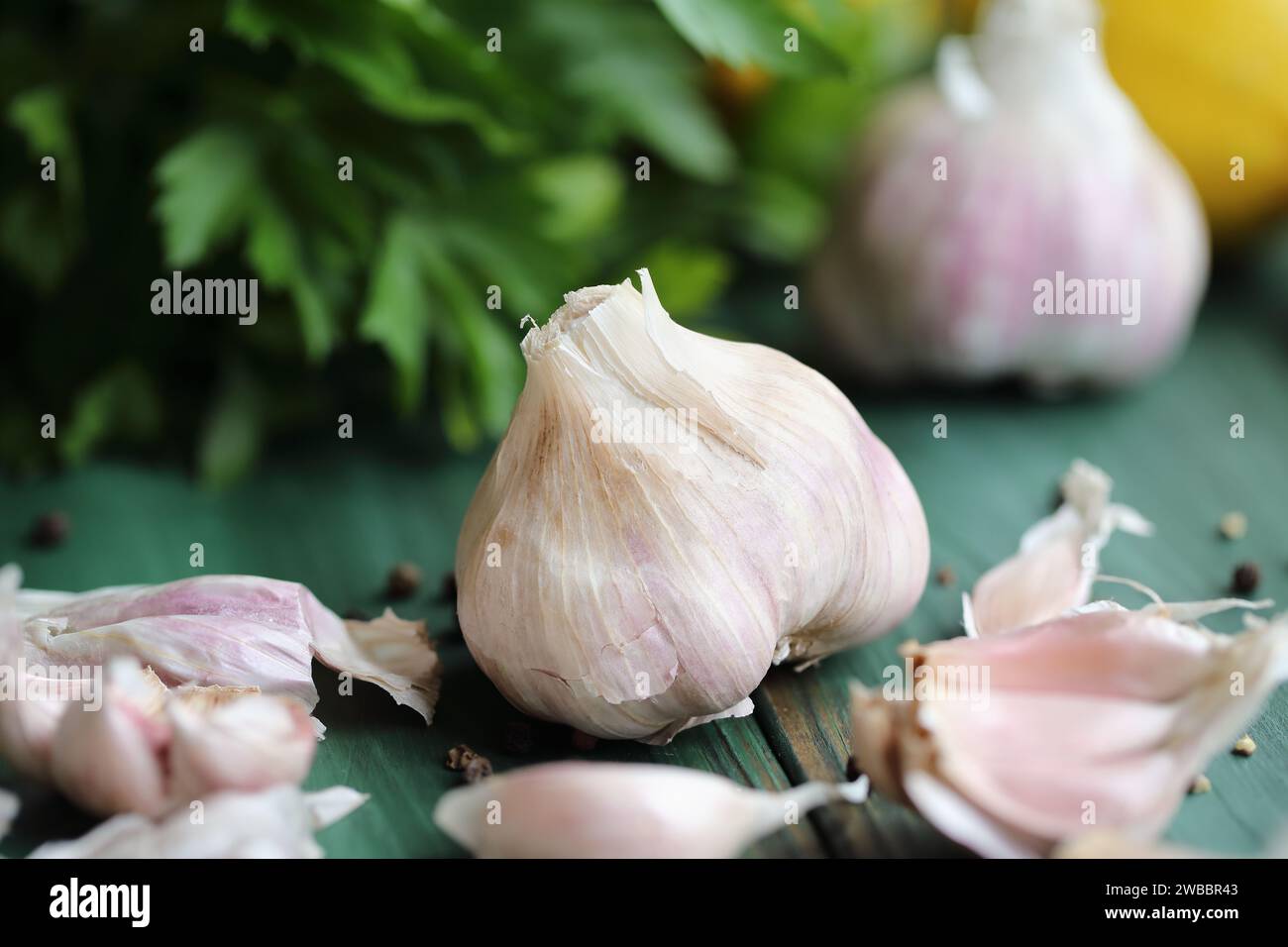 Fresh garlic cloves and ingredients to make toum sauce or a salad