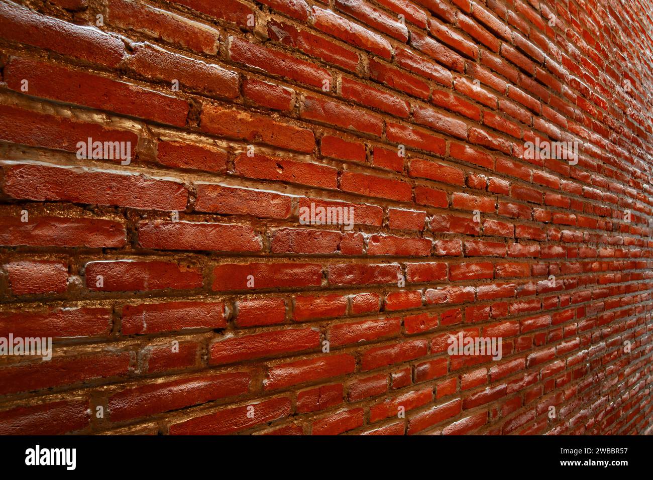 The red brick wall seen perspective from the side for background Stock Photo