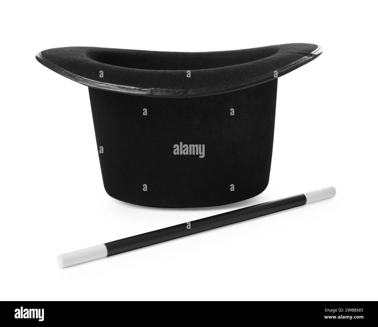 Black top hat and wand isolated on white. Magician equipment Stock