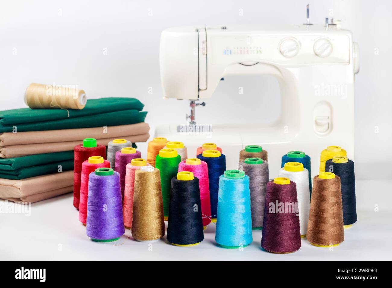 With fabric and thread sewing machine is used Stock Photo - Alamy