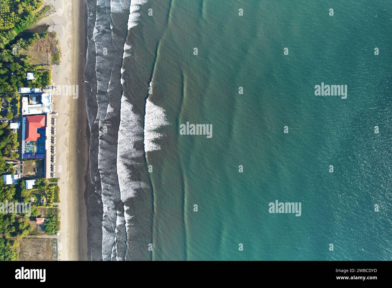 Big hotel resort next to ocean beach above top drone view Stock Photo