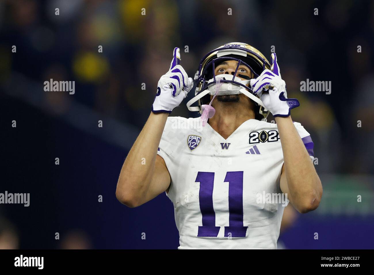 HOUSTON, TX - JANUARY 08: Washington Huskies wide receiver Jalen McMillan (11) celebrates after a 3-yard touchdown catch in the second quarter of the CFP National Championship against the Michigan Wolverines on January 08, 2024 at NRG Stadium in Houston, Texas. (Photo by Joe Robbins/Image of Sport) Stock Photo