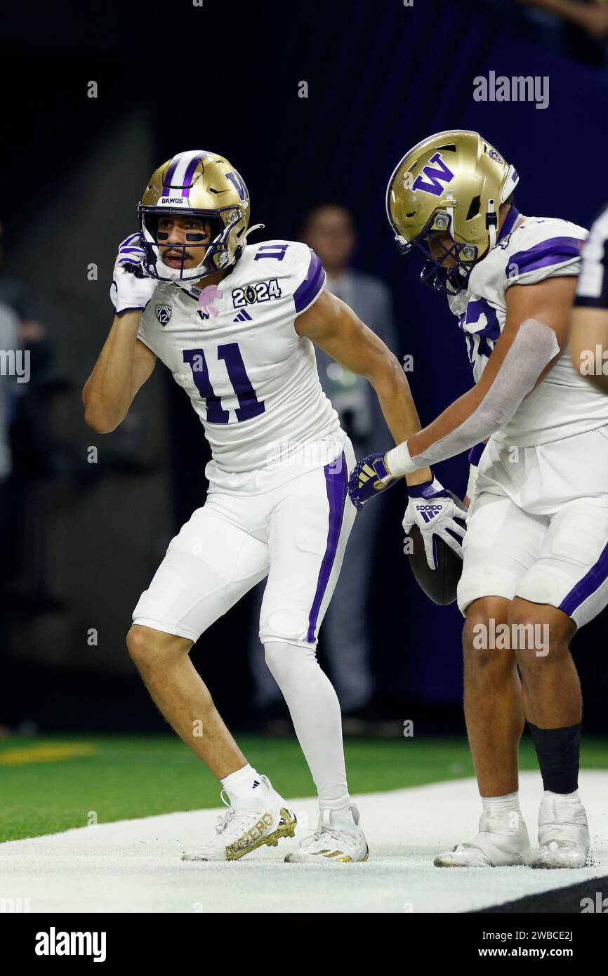 HOUSTON, TX - JANUARY 08: Washington Huskies wide receiver Jalen McMillan (11) celebrates after a 3-yard touchdown catch in the second quarter of the CFP National Championship against the Michigan Wolverines on January 08, 2024 at NRG Stadium in Houston, Texas. (Photo by Joe Robbins/Image of Sport) Stock Photo