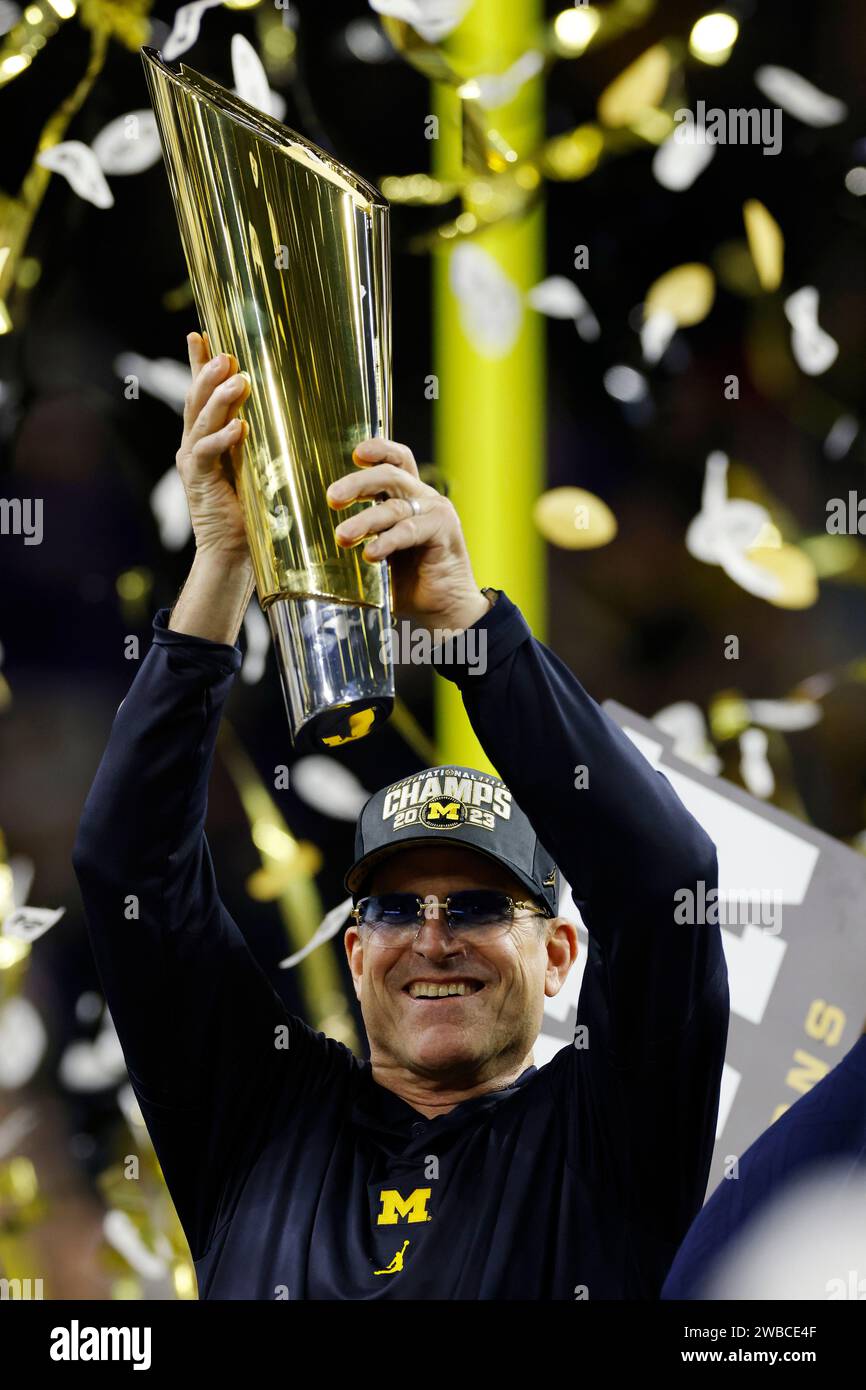 HOUSTON, TX - JANUARY 08: Michigan Wolverines head coach Jim Harbaugh celebrates following the CFP National Championship against the Washington Huskies on January 08, 2024 at NRG Stadium in Houston, Texas. (Photo by Joe Robbins/Image of Sport) Stock Photo