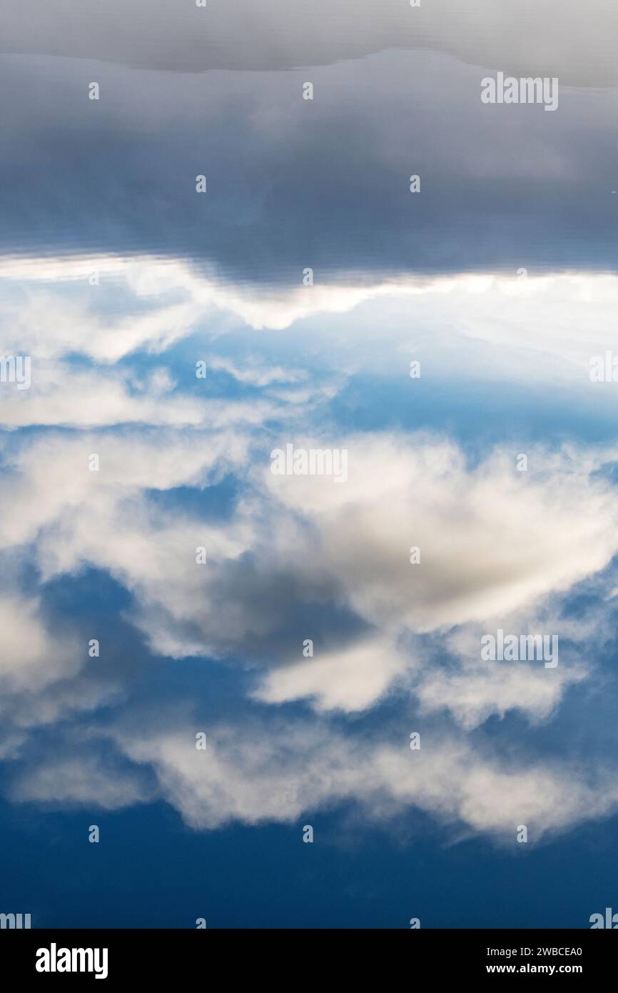 Clouds reflecting in a loch. Highlands, Scotland Stock Photo