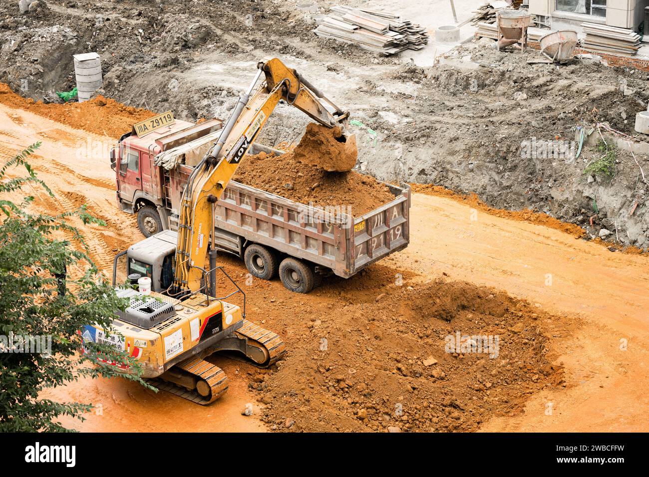 Excavator digging the land Stock Photo Alamy