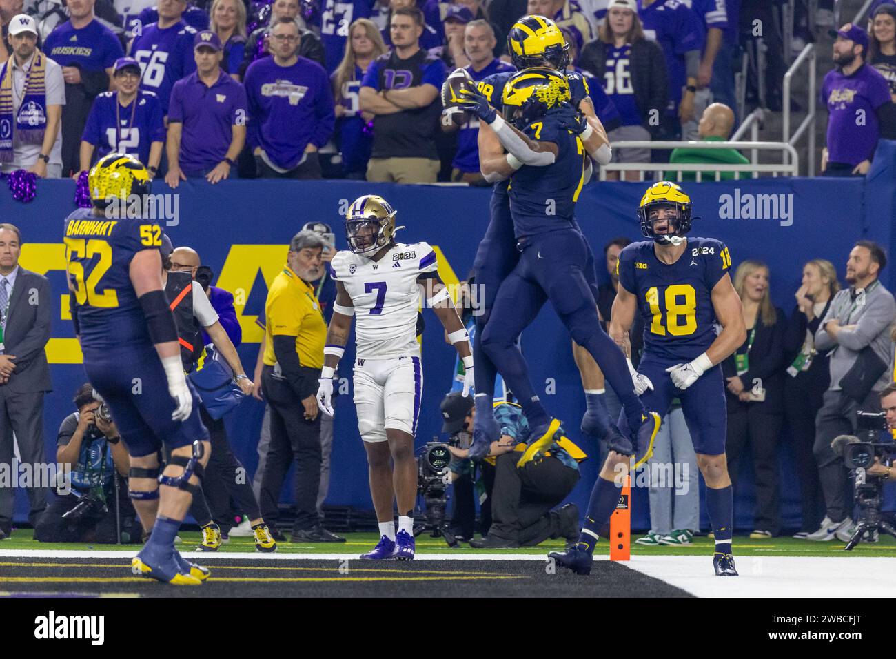 Michigan Wolverines running back Donovan Edwards (7) and defensive lineman Alessandro Lorenzetti (89) celebrate a touchdown against the Washington Hus Stock Photo