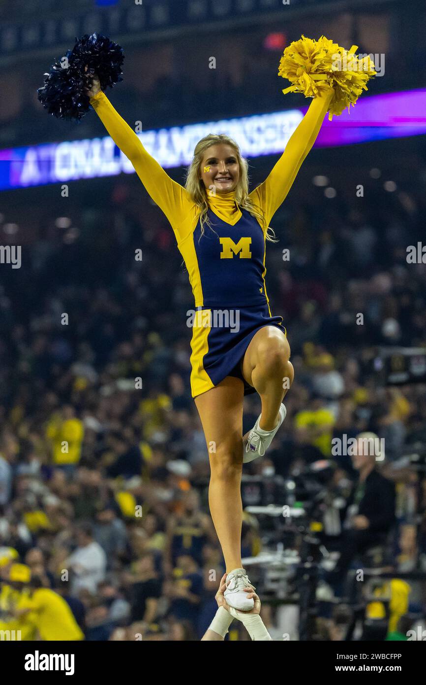 Michigan Wolverines cheerleader entertains the crowd during the 2024 College Football Playoff National Championship game, Monday, Feb. 20, 2023, in Ho Stock Photo