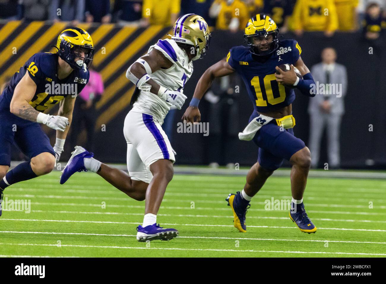 Michigan Wolverines quarterback Alex Orji (10) carries the ball as