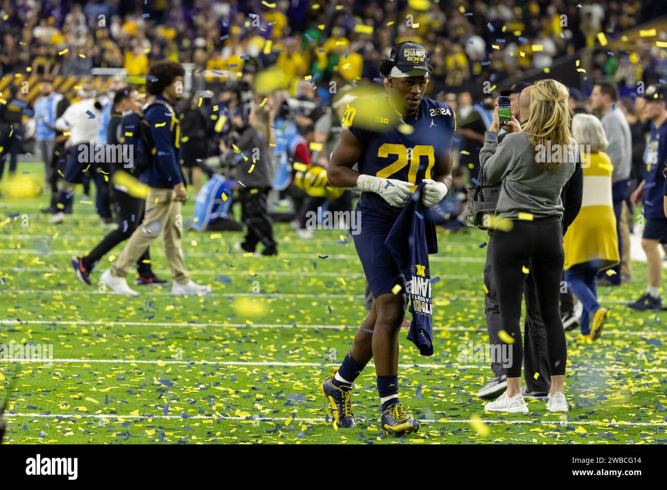 Michigan Wolverines running back Kalel Mullings (20) runs through the victory confetti during the 2024 College Football Playoff National Championship Stock Photo