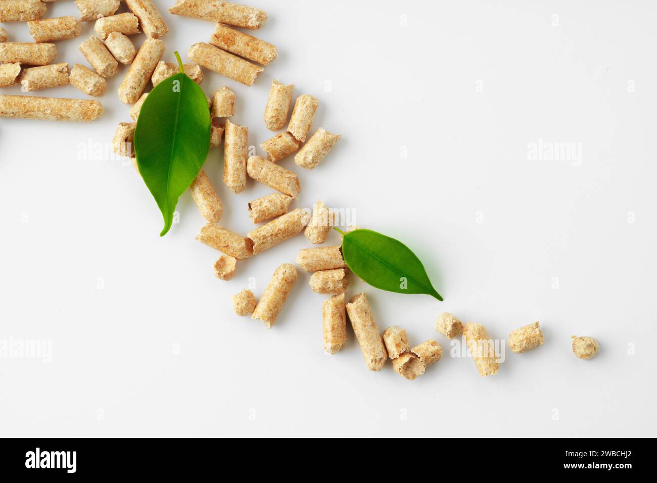 Wood pellets biofuel isolated on white background Stock Photo - Alamy